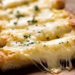 Make This Quick Cheesy Garlic Bread Everyone Begs For 3 quick cheesy garlic bread with melted mozzarella and parsley