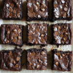 Cottage Cheese Brownies: Unlock Rich Flavor With Half the Guilt 3 cottage cheese brownies stacked with rich chocolate drizzle