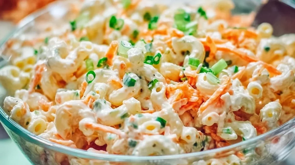 Creamy classic Hawaiian macaroni salad in a bowl, garnished with parsley.