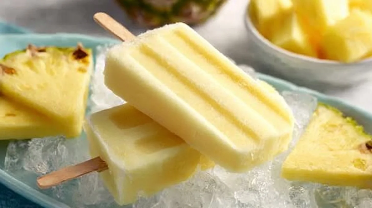 Homemade Dole Whip popsicles ready to enjoy on a sunny day