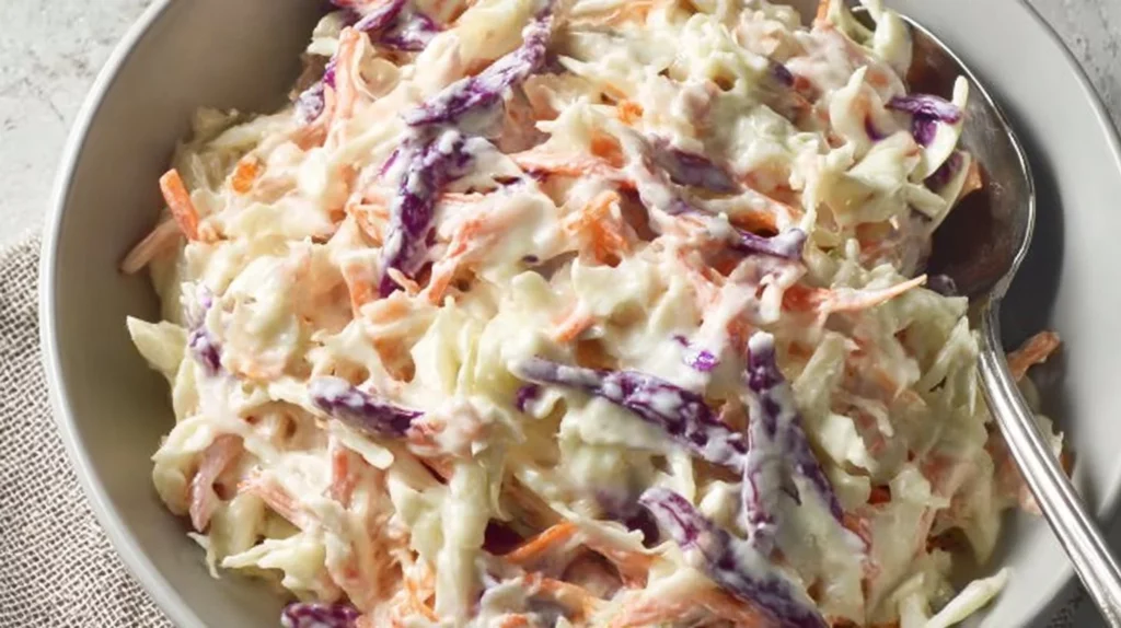 Bowl of best creamy coleslaw with fresh cabbage and carrots