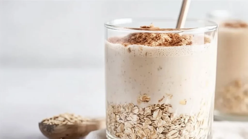 Cinnamon Roll Breakfast Smoothie topped with cinnamon and whipped cream