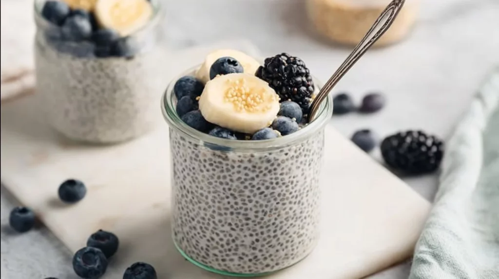 Vanilla Chia Seed Pudding topped with fresh fruits in a glass bowl.