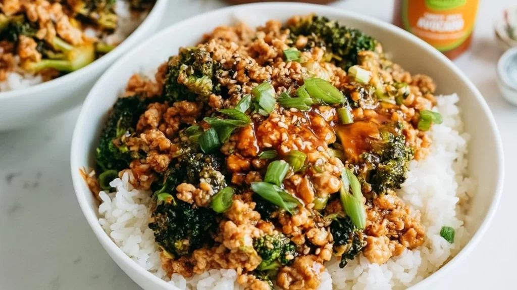 Firecracker ground chicken served in a bowl with fresh vegetables