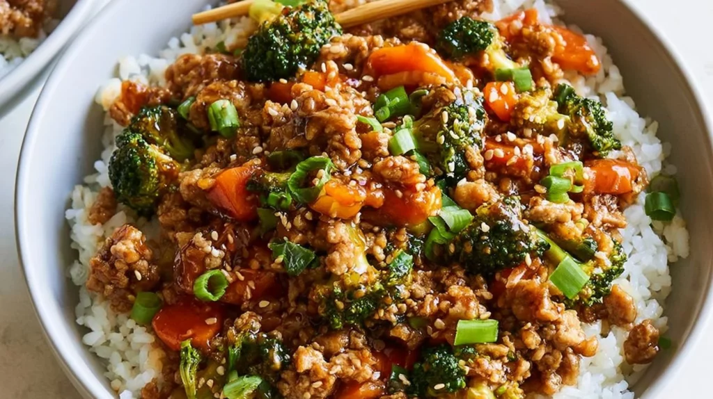 Delicious teriyaki turkey rice bowl garnished with vegetables and sesame seeds