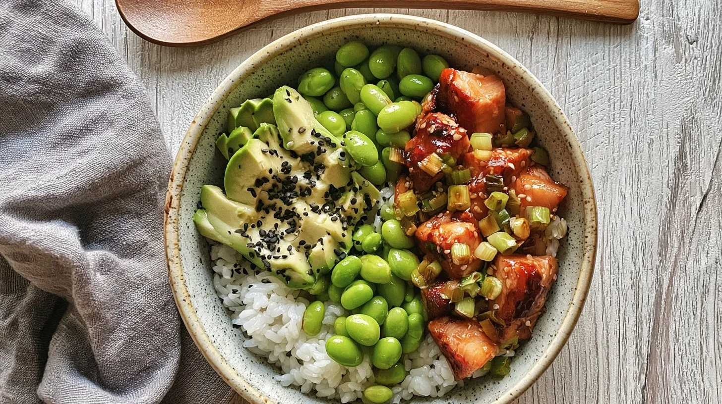 Delicious Teriyaki Salmon Sushi Bowl with rice, vegetables, and sushi sauce.